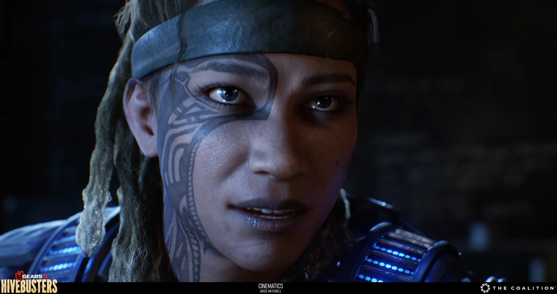 Close cinematic frame of a woman with facial markings and illuminated blue armour