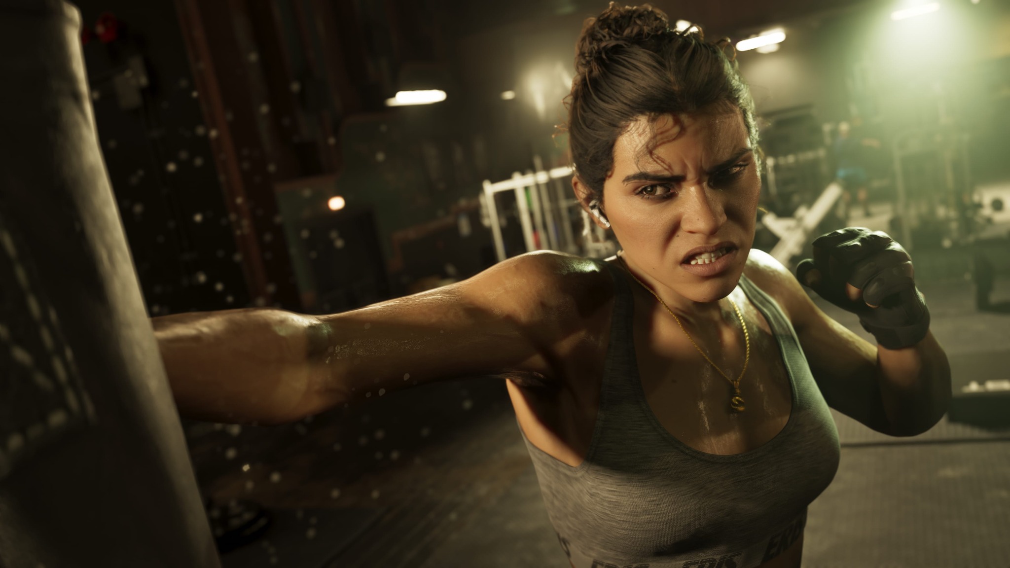 Lucia throws a punch in a dim gym under warm overhead lights