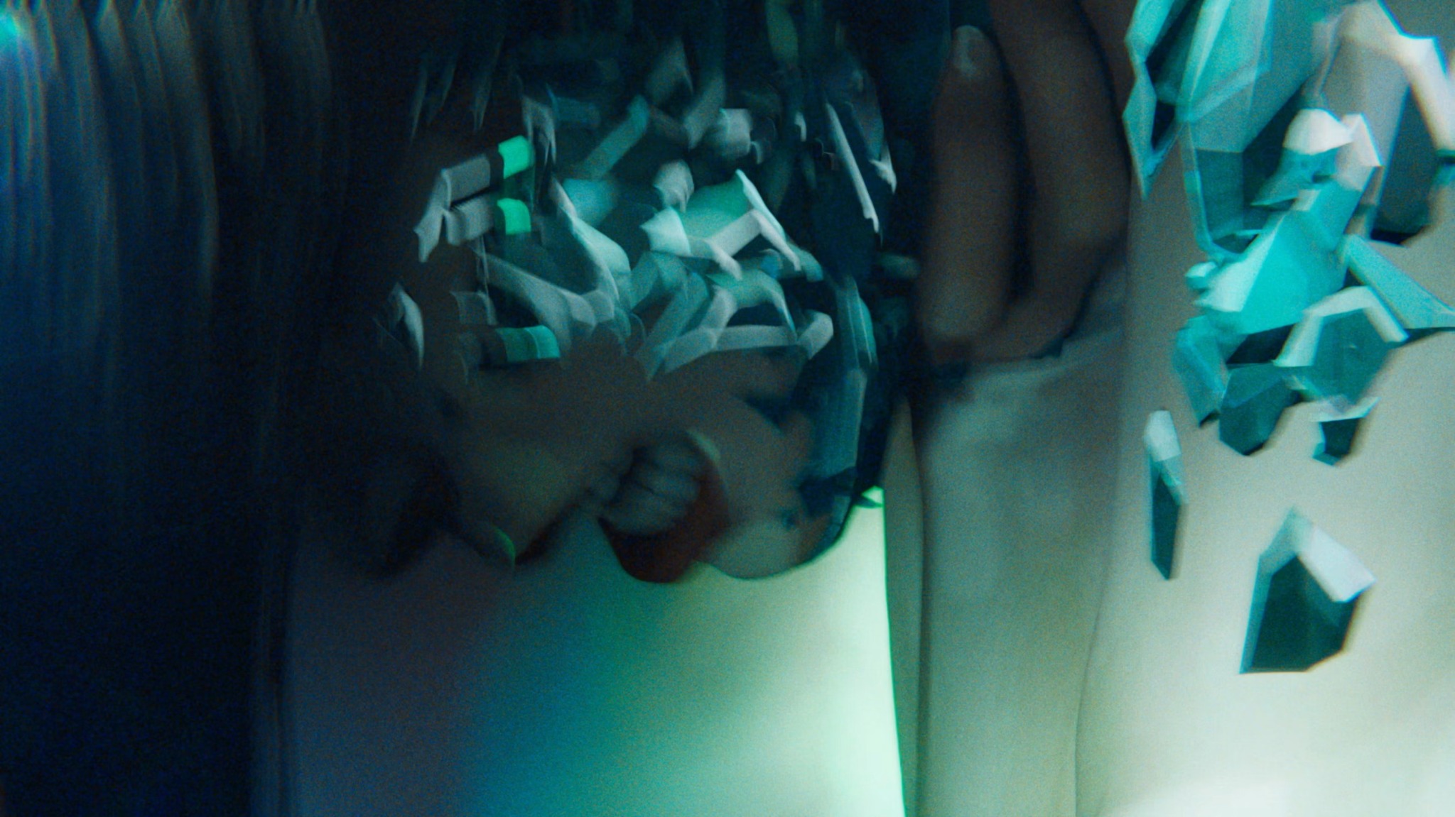A close view of Sage with crystal fragments along her face and shoulder.